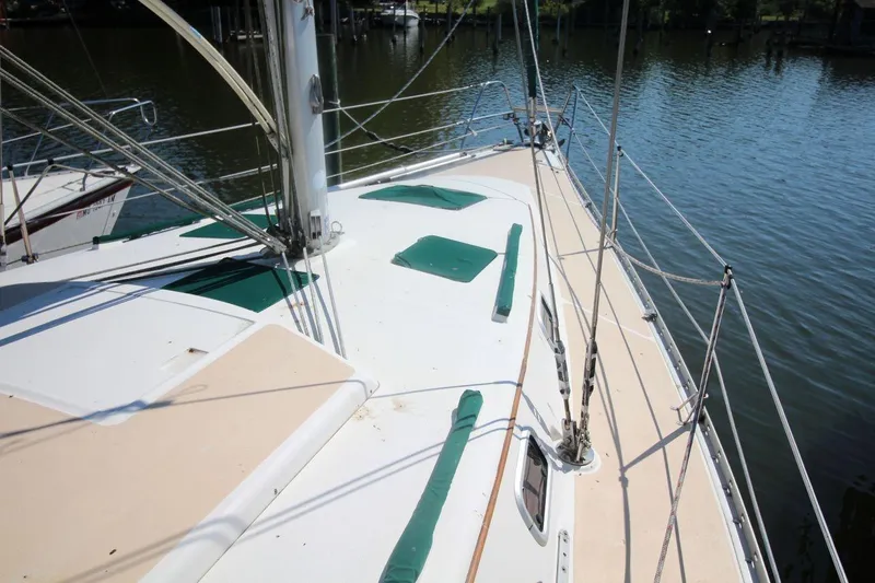 Slide: The Image of Sailboat deck of 1991 Hunter 37.5, docked by calm waters. - 3