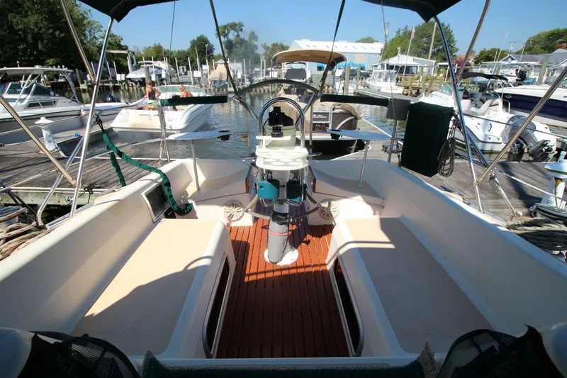 Slide: The Image of Cockpit of a 1991 Hunter 37.5 sailboat docked at a marina. - 6