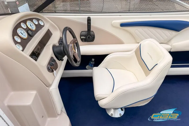 Slide: The Image of 1998 Monterey 236 Montura boat interior with steering wheel and gauges. - 13