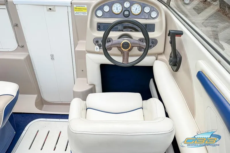 Slide: The Image of 1998 Monterey 236 Montura boat interior with steering wheel and dashboard controls. - 17