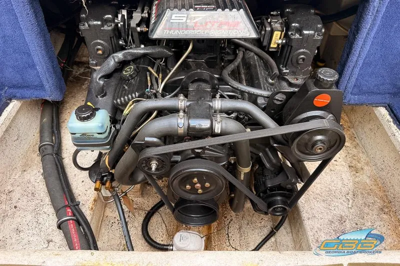 Slide: The Image of Engine of 1998 Monterey 236 Montura boat with visible components and belts. - 18