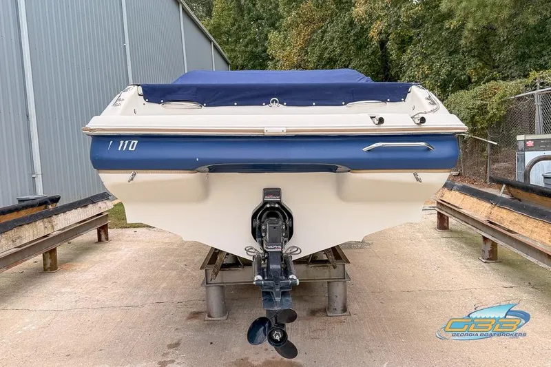Slide: The Image of 1998 Monterey 236 Montura boat on trailer, rear view, blue and white design. - 22