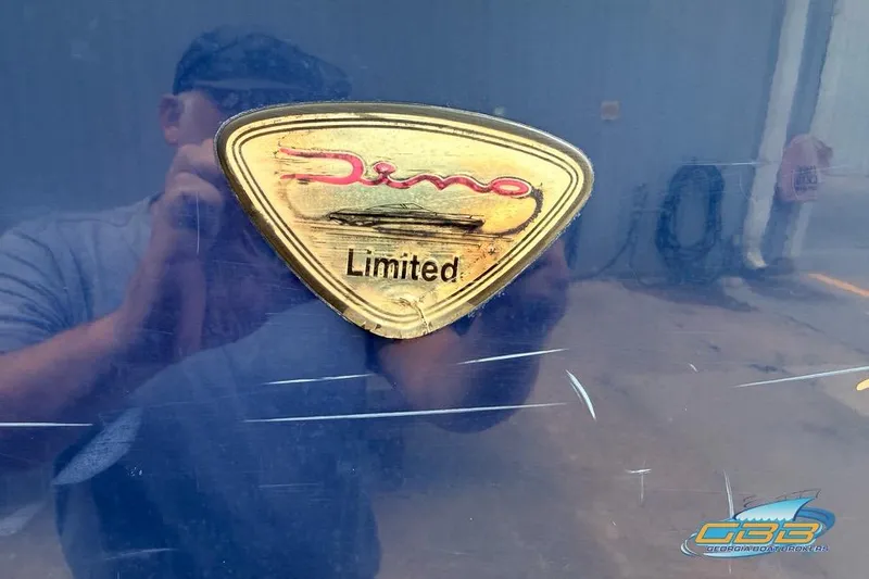 Slide: The Image of Gold "Dino Limited" badge on a 1998 Monterey 236 Montura boat. - 25