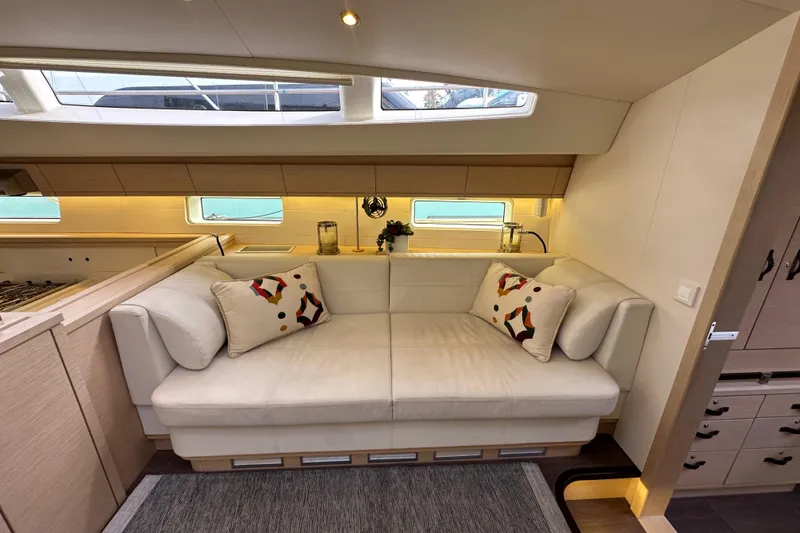 Slide: The Image of Luxurious interior of 2017 Jeanneau 64 yacht with elegant seating and modern decor. - 107