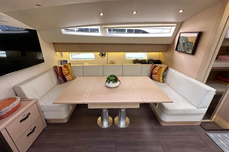 Slide: The Image of Luxurious interior of 2017 Jeanneau 64 yacht with elegant dining area and modern decor. - 109