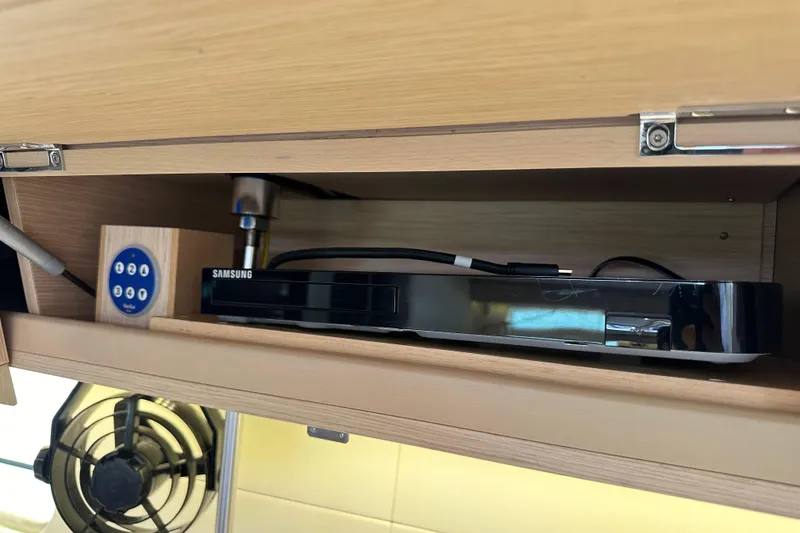 Slide: The Image of Cabinet in 2017 Jeanneau 64 yacht with Samsung device and control panel. - 112