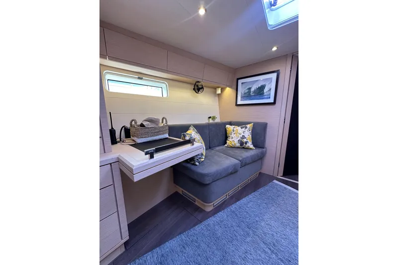 Slide: The Image of Luxurious interior of 2017 Jeanneau 64 yacht with cozy seating and elegant decor. - 118
