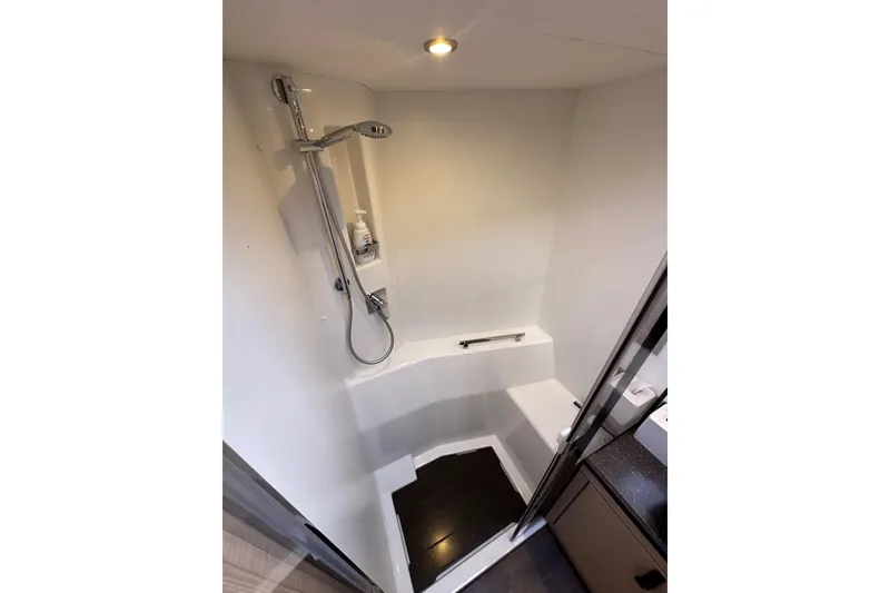 Slide: The Image of Shower area in 2017 Jeanneau 64 yacht, featuring modern fixtures and sleek design. - 122