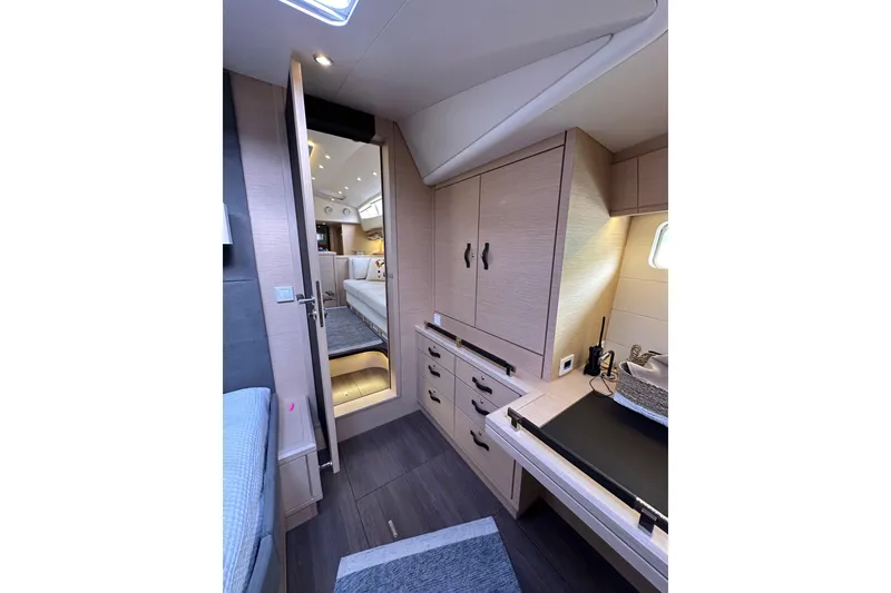 Slide: The Image of Luxurious interior of 2017 Jeanneau 64 yacht, featuring elegant cabinetry and modern design. - 127