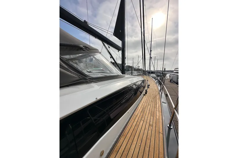 Slide: The Image of Jeanneau 64 yacht, 2017 model, showcasing sleek deck design and modern features. - 16