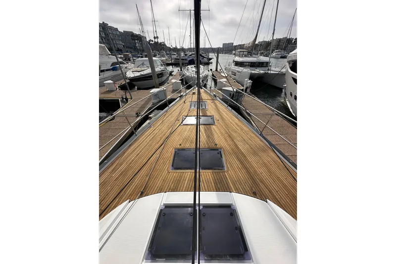 Slide: The Image of Deck view of 2017 Jeanneau 64 yacht docked at marina. - 19