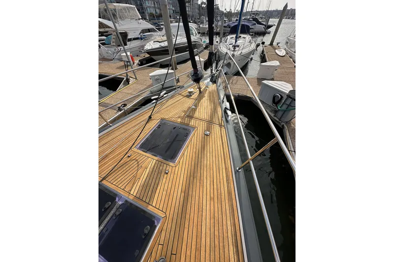 Slide: The Image of 2017 Jeanneau 64 yacht with teak deck, docked at marina. - 20