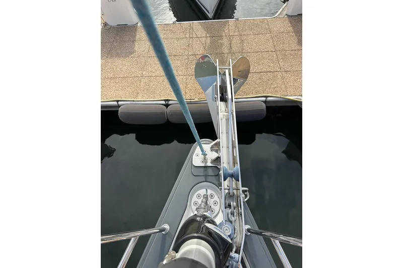 Slide: The Image of Bow view of 2017 Jeanneau 64 yacht with anchor and mooring line. - 27