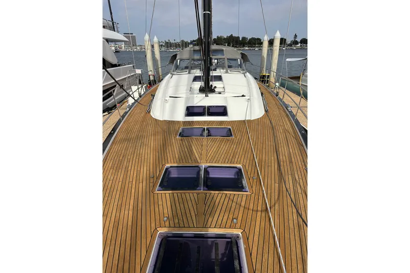 Slide: The Image of 2017 Jeanneau 64 yacht with sleek wooden deck and modern design. - 28