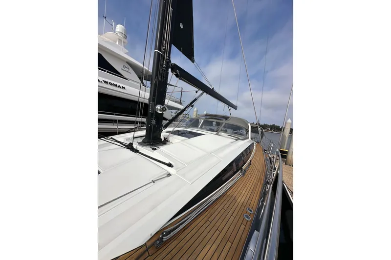 Slide: The Image of 2017 Jeanneau 64 yacht with sleek deck and modern design, docked at marina. - 31