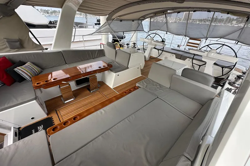 Slide: The Image of Luxurious 2017 Jeanneau 64 yacht interior with elegant seating and dual steering wheels. - 34