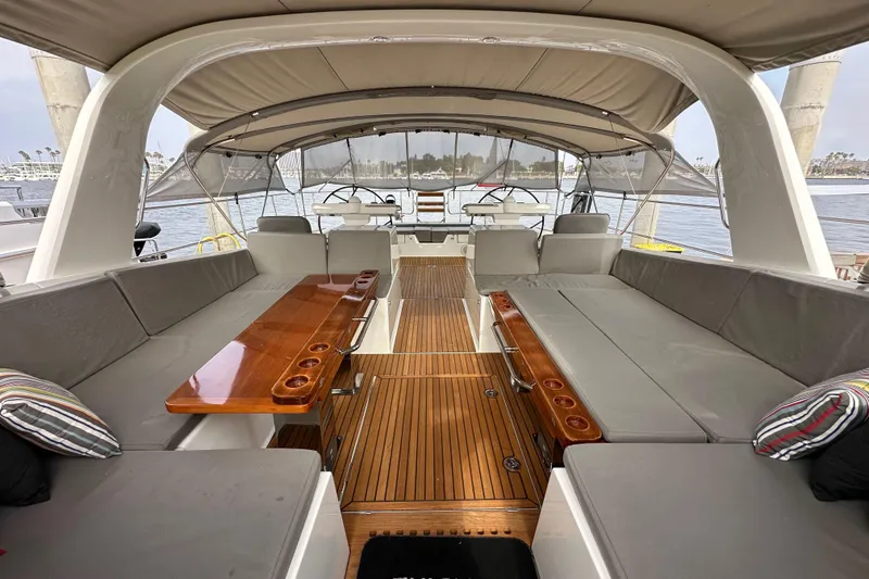 Slide: The Image of Luxurious 2017 Jeanneau 64 yacht interior with spacious seating and elegant wood finish. - 35