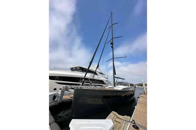 Slide: The Image of 2017 Jeanneau 64 yacht docked at marina under clear blue sky. - 4
