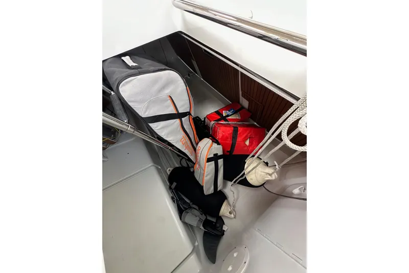 Slide: The Image of Storage area on 2017 Jeanneau 64 sailboat with bags and equipment. - 41