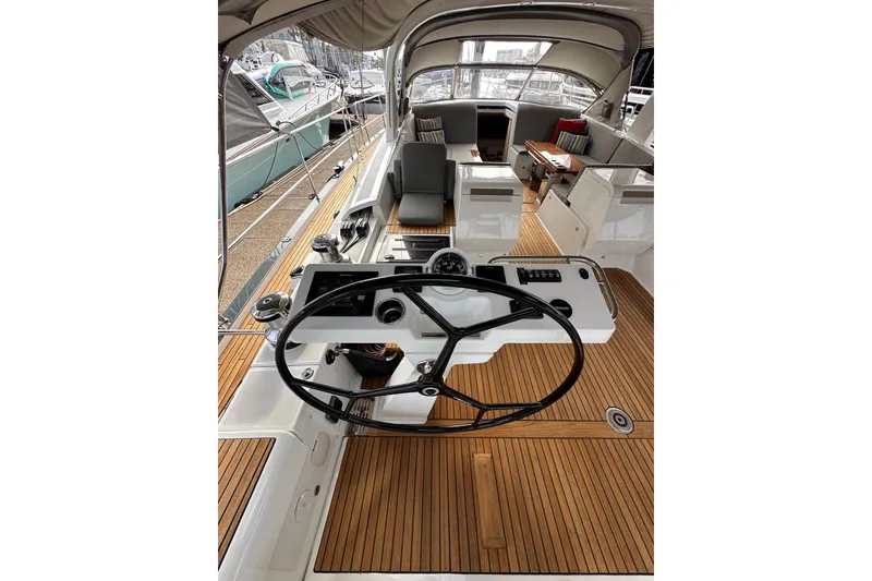 Slide: The Image of 2017 Jeanneau 64 yacht cockpit with teak flooring and modern steering wheel. - 46