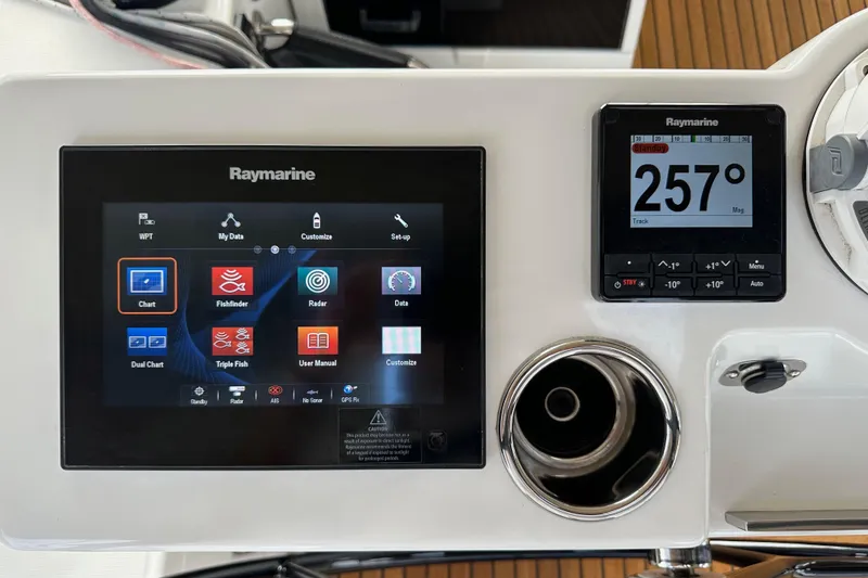 Slide: The Image of Raymarine navigation system on 2017 Jeanneau 64 yacht, displaying charts and compass. - 52