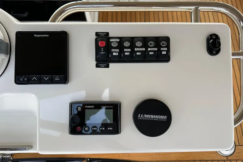 Slide: The Image of Control panel of a 2017 Jeanneau 64 yacht with Raymarine and Lumishore systems. - 53