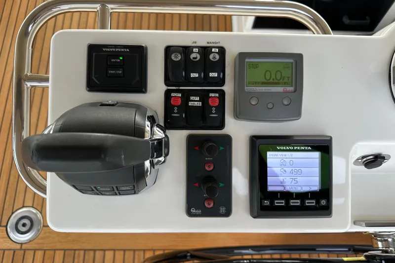 Slide: The Image of Control panel of a 2017 Jeanneau 64 yacht with Volvo Penta displays and controls. - 54