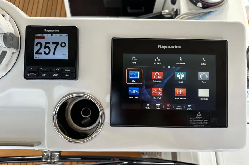 Slide: The Image of Raymarine navigation display on 2017 Jeanneau 64 yacht, showing compass and multifunction screen. - 55
