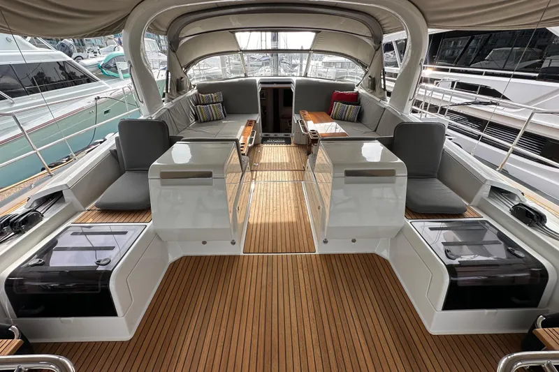 Slide: The Image of Luxurious 2017 Jeanneau 64 yacht interior with elegant seating and teak flooring. - 57