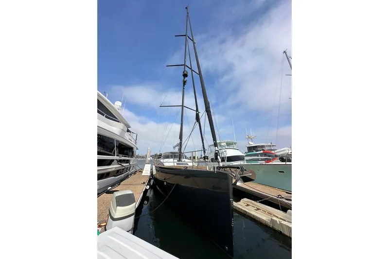 Slide: The Image of 2017 Jeanneau 64 yacht docked at marina under clear blue sky. - 6