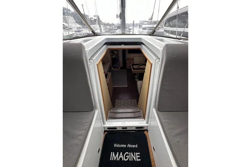 Slide: The Image of Entrance to 2017 Jeanneau 64 yacht interior with "Welcome Aboard" mat. - 65