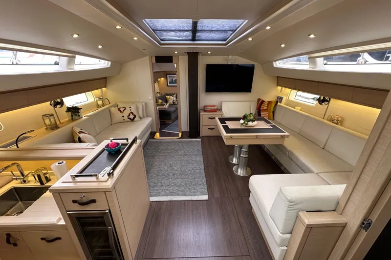 Slide: The Image of Luxurious interior of a 2017 Jeanneau 64 yacht with elegant seating and modern amenities. - 67