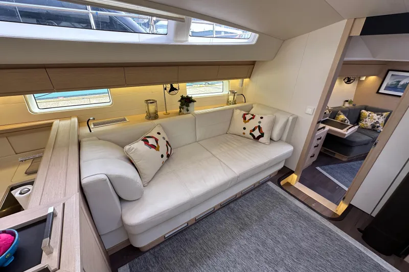 Slide: The Image of Luxurious interior of 2017 Jeanneau 64 yacht with elegant seating and modern decor. - 72