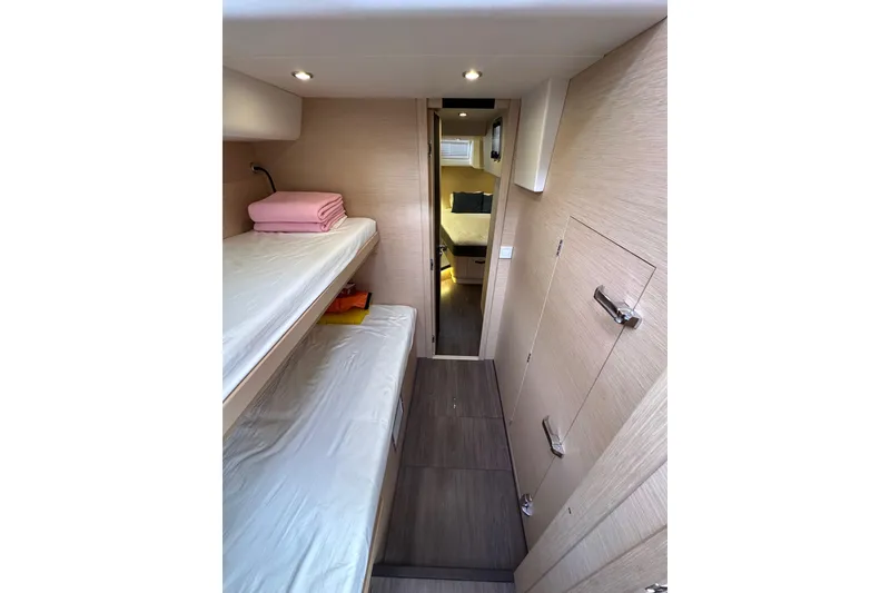 Slide: The Image of Interior of 2017 Jeanneau 64 yacht with bunk beds and modern design. - 77