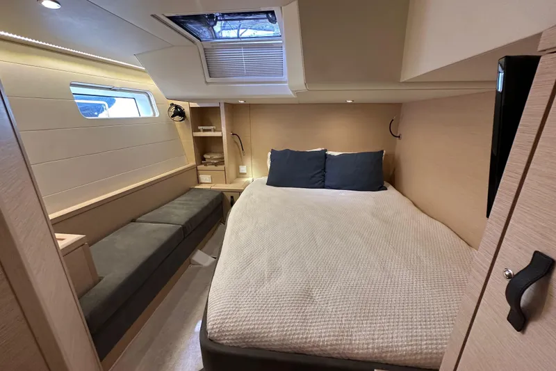 Slide: The Image of Luxurious cabin interior of 2017 Jeanneau 64 yacht with cozy bed and modern design. - 79