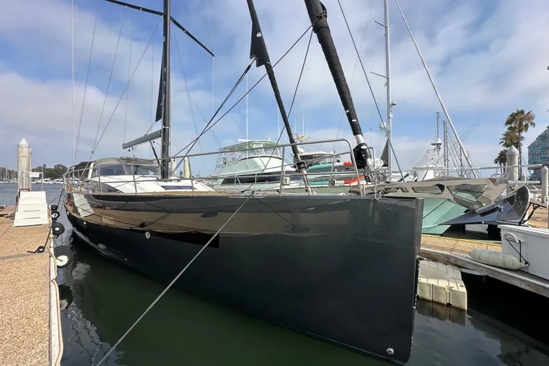 Slide: The Image of Luxury 2017 Jeanneau 64 yacht docked at marina under clear sky. - 8