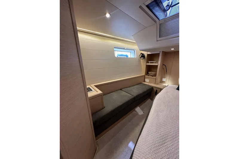 Slide: The Image of Luxurious interior of 2017 Jeanneau 64 yacht with modern furnishings and natural light. - 80
