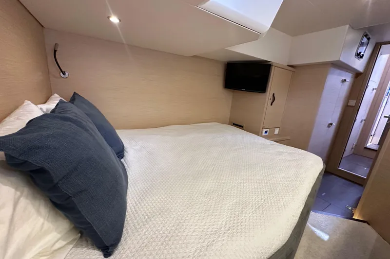 Slide: The Image of Luxurious cabin interior of 2017 Jeanneau 64 yacht with cozy bed and modern amenities. - 82