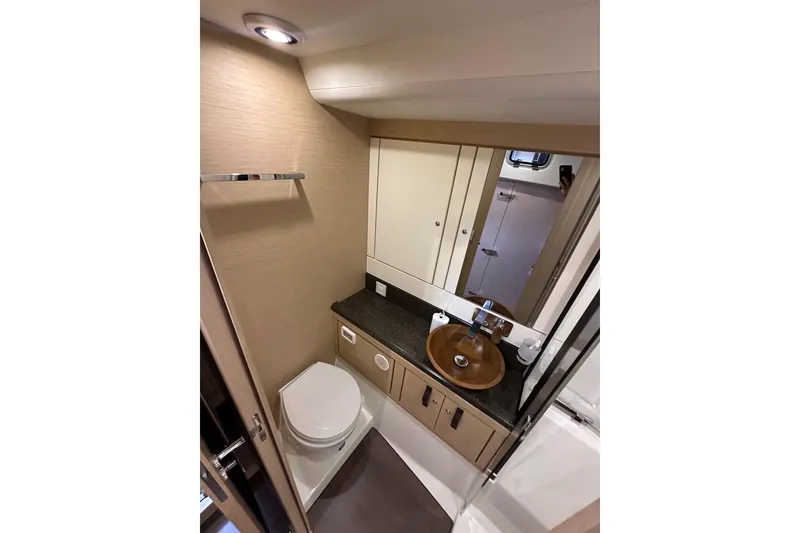 Slide: The Image of Luxurious bathroom in 2017 Jeanneau 64 yacht with modern fixtures and elegant design. - 85