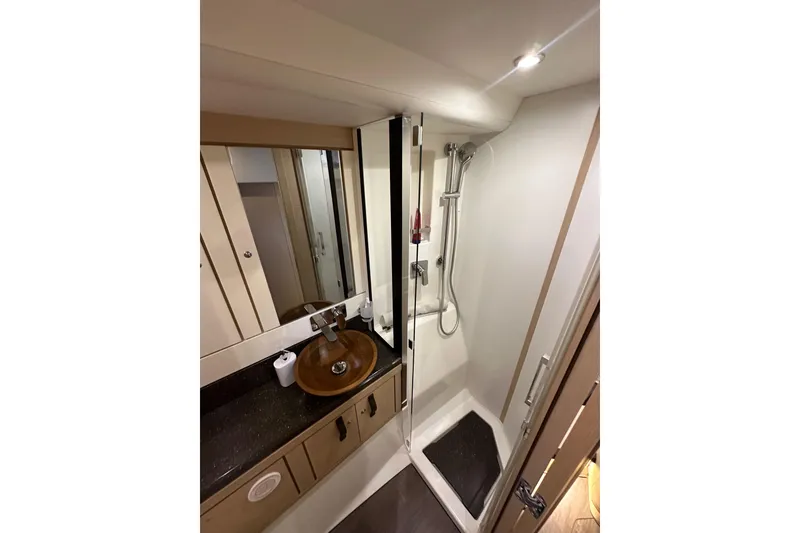 Slide: The Image of Luxurious bathroom in 2017 Jeanneau 64 yacht with modern fixtures and elegant design. - 86