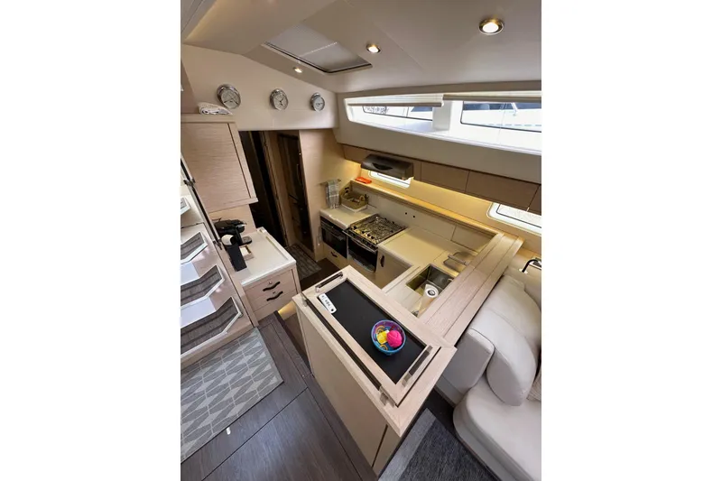 Slide: The Image of Luxurious interior of 2017 Jeanneau 64 yacht featuring modern kitchen and elegant design. - 88