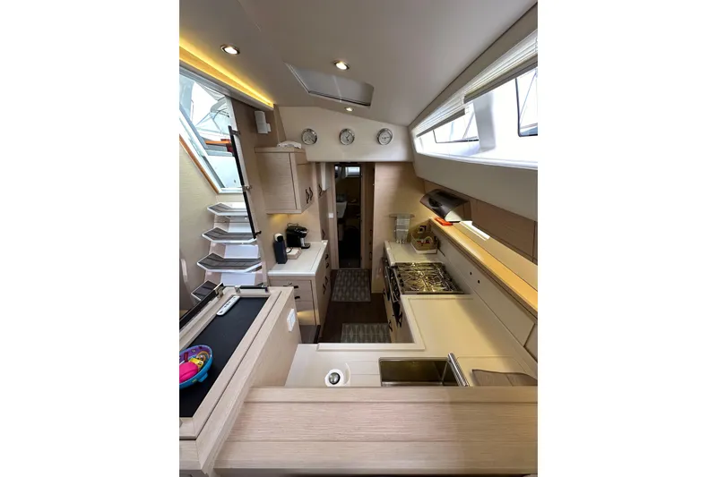 Slide: The Image of Luxurious interior of 2017 Jeanneau 64 yacht featuring modern kitchen and sleek design. - 89