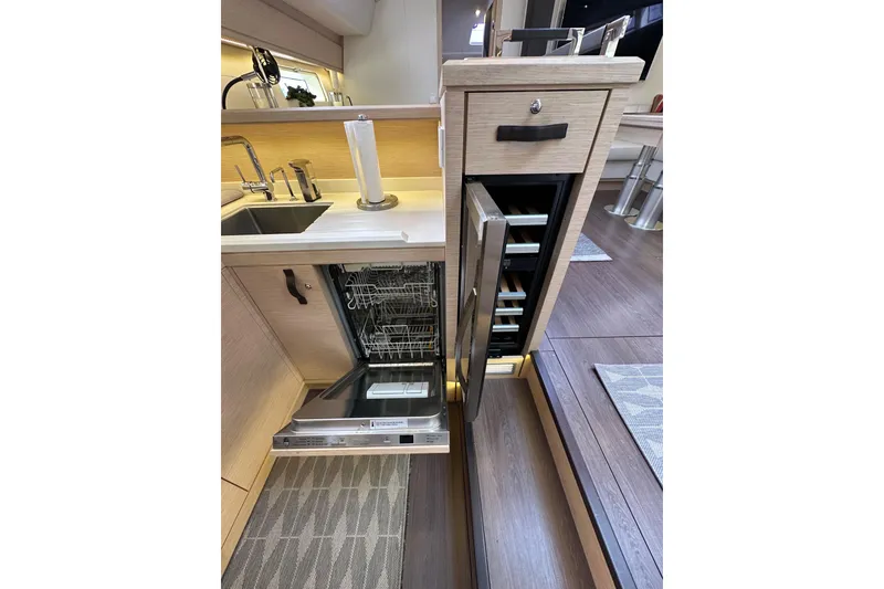 Slide: The Image of Modern kitchen in 2017 Jeanneau 64 yacht with dishwasher and wine cooler. - 92