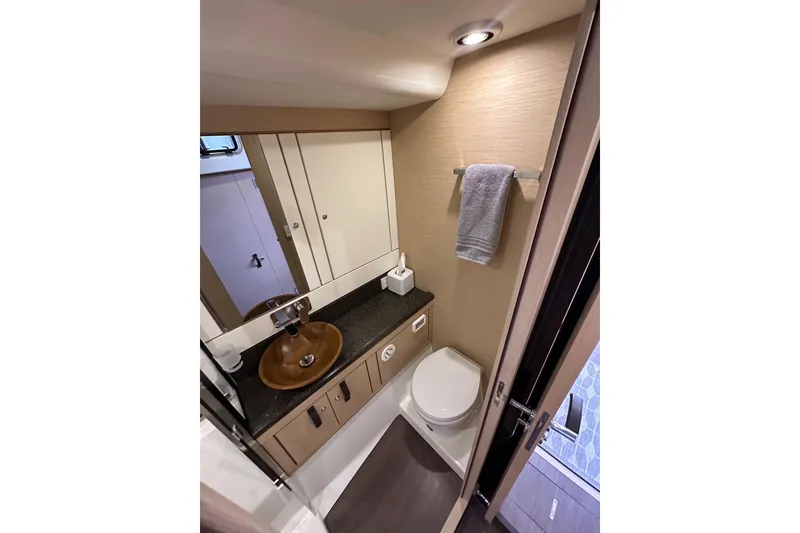 Slide: The Image of Luxurious bathroom in 2017 Jeanneau 64 yacht with modern fixtures and elegant design. - 99