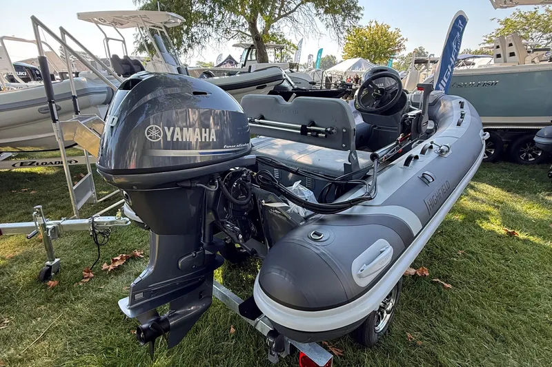 Slide: The Image of 2025 Highfield Classic 380 boat with Yamaha outboard motor on display outdoors. - 2