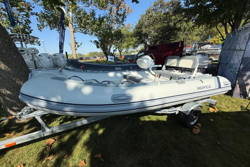 The Image of 2025 Highfield Classic 380 inflatable boat on trailer, displayed outdoors. - 0