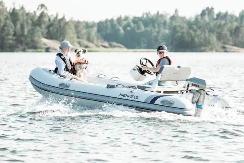 Slide: The Image of Manufacturer Provided Image: Highfield Classic 380 boat on water, 2025 model, with passengers enjoying a ride. - 9