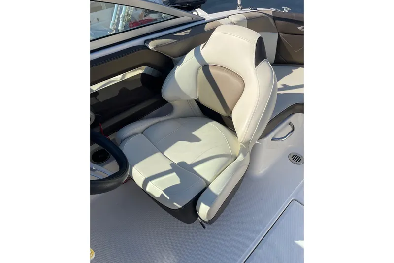 Slide: The Image of 2019 Chaparral 210 Suncoast boat seat, featuring sleek white and gray design. - 15
