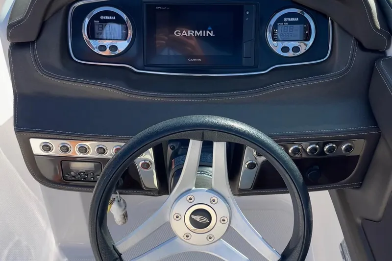 Slide: The Image of Dashboard of 2019 Chaparral 210 Suncoast boat with Garmin display and Yamaha gauges. - 16