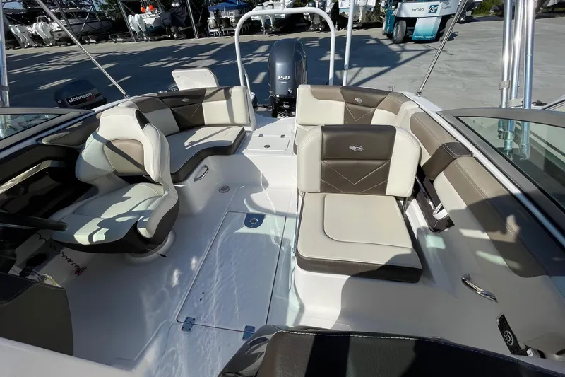 Slide: The Image of 2019 Chaparral 210 Suncoast boat interior with seating and steering wheel. - 22